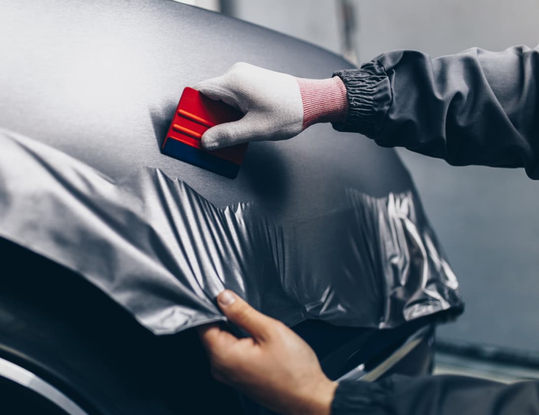 Dark Desire Window Tint and Vinyl Wrapping a car with vinyl wrap