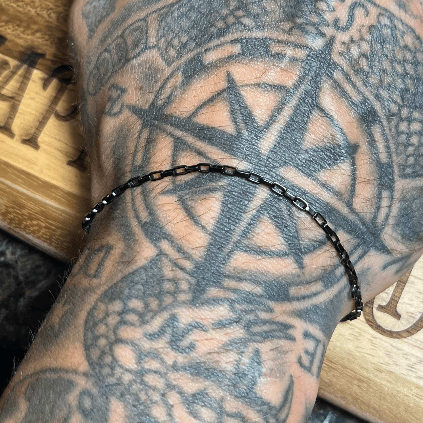 Black permanent jewelry bracelet made by Dark Desire Window Tint and Vinyl